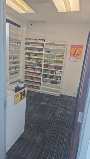 Sault Ste Marie Vape Store interior with shelves stocked with products and a counter.
